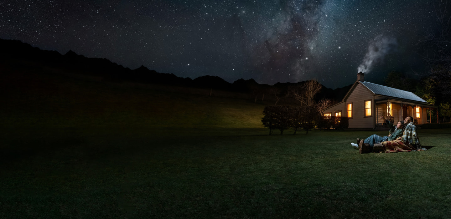 Father and daughter stargazing in Otago, New Zealand